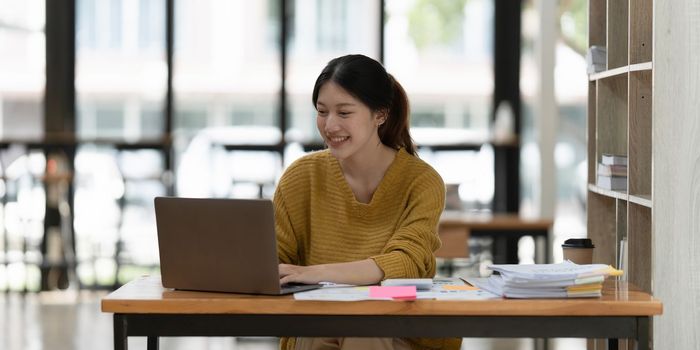 Smart asian business woman smiling at office space. real estate, lawyer, non-profit, marketing, account.