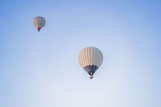 Beautiful hot air balloons over blue sky.