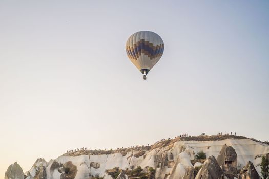 Colorful hot air balloon flying over Cappadocia, Turkey.