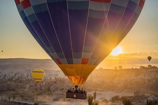 Colorful hot air balloon flying over Cappadocia, Turkey.