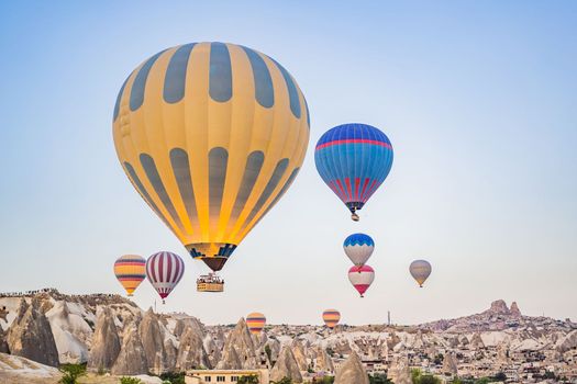 Colorful hot air balloon flying over Cappadocia, Turkey.