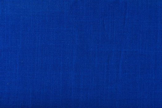 Texture of fabric for furniture upholstery. Wear-resistant fabric for furniture. Texture of blue fabric close up top view