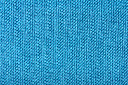Texture of fabric for furniture upholstery. Wear-resistant fabric for furniture. Texture of blue fabric close up top view