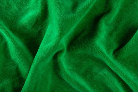 The texture of a microfiber cloth close-up. Napkins for cleaning and cleaning green surfaces. Washable