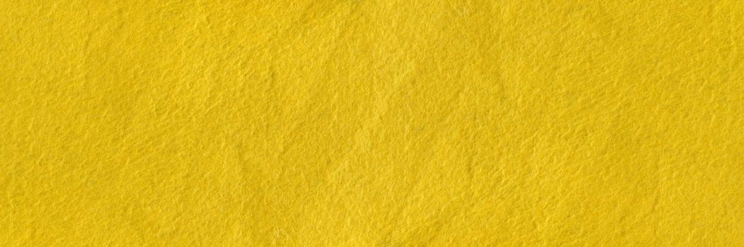 Texture of yellow felt. Abstract background with yellow felt. High resolution photo