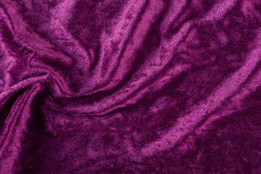 Beautiful purple silk satin background. Soft folds on a shiny fabric. Birthday, Christmas, Valentine's Day. Luxury background with copy space for text, design, web banner