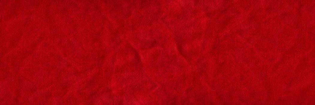 Red velvet texture for postcard or background for design. Red background for Christmas theme or Valentine's day, high quality, large format