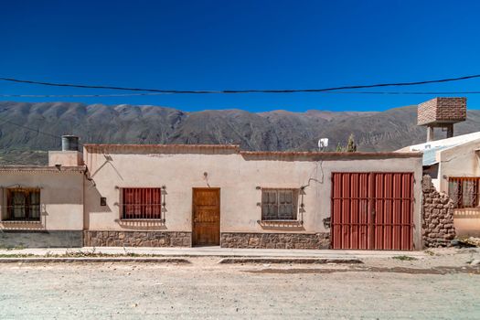 a house made of clay and red bricks in the countryside of Aregenina in the Andes mountains. 