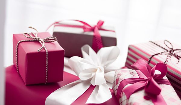Holiday gifts and wrapped luxury presents, pink gift boxes as surprise present for birthday, Christmas, New Year, Valentines Day, boxing day, wedding and holidays shopping or beauty box delivery concept