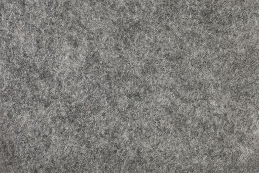 Felt texture. Texture of gray felt. Abstract background with natural gray felt. High resolution texture photo.