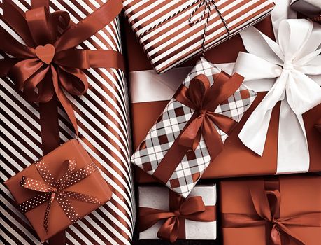 Holiday gifts and wrapped luxury presents, chocolate gift boxes as surprise present for birthday, Christmas, New Year, Valentines Day, boxing day, wedding and holidays shopping or beauty box delivery concept