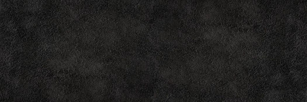 Black suede close-up. Natural black suede texture for design or project. Velvet, leather reverse