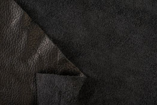 Black suede close-up. Natural black suede texture for design or project. Velvet, leather reverse