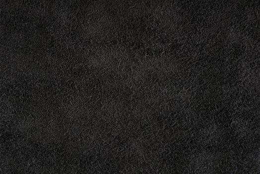 Black suede close-up. Natural black suede texture for design or project. Velvet, leather reverse