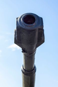 Soviet light amphibious tank PT-76. Object 740. Tank barrel, barrel against the sky. Tank gun. muzzle or flame arrester close-up
