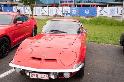 Genk, BELGIUM, August 18, 2021: classic summer meet of oldtimer at The Luminus Arena Genk,red Opel GT 1975, High quality photo