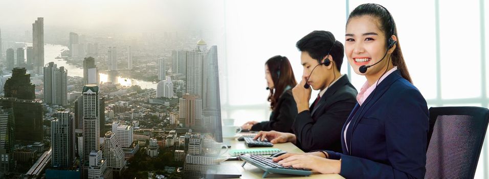 Business people wearing headset working in office in widen view to support remote customer or colleague. Call center, telemarketing, customer support agent provide service on telephone video call.