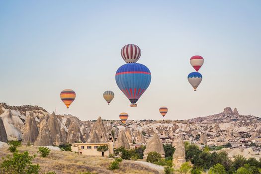 Colorful hot air balloon flying over Cappadocia, Turkey.