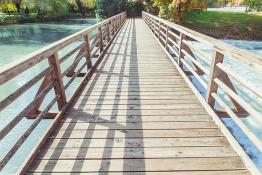 Wooden footbridge over the Pivka river in Slovenia.