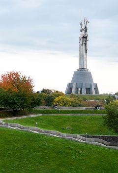 Statue of the Motherland against the blue sky. The fifth largest statue in the world and the highest in Ukraine. Located on the territory of the Museum of the History of Ukraine in World War II