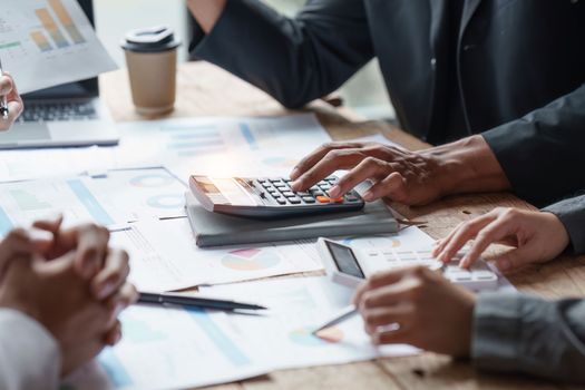 Group of Business people meeting for analysis data figures to plan business strategies. Business discussing, finance concept.