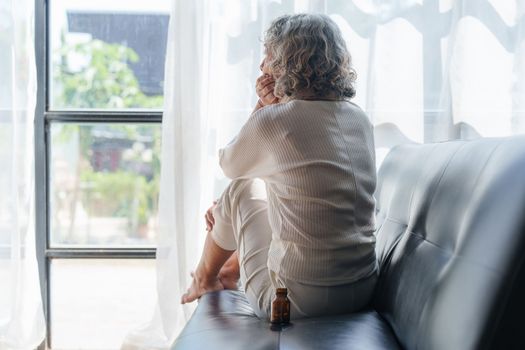 Pensive older woman lonely old senior in is home.