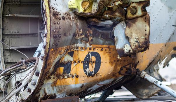 Detail of the Mi-24 helicopter. Remains of a destroyed Russian Air Force combat helicopter Hind Crocodile. Engine rotor, blades, tail, wreckage of a crashed military attack helicopter close-up