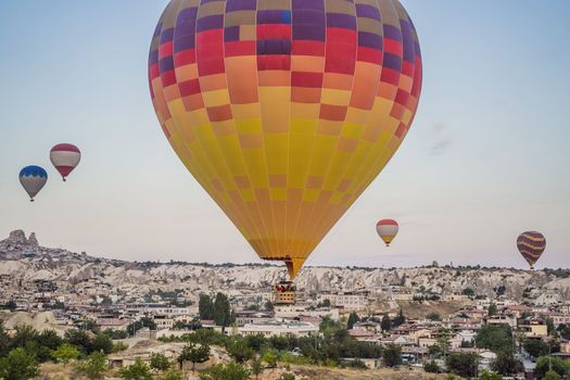 Colorful hot air balloon flying over Cappadocia, Turkey.