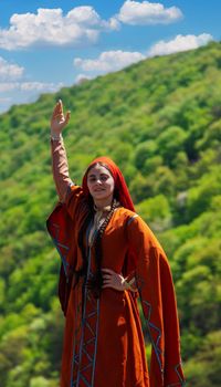 Georgian girl in national costume dances Georgian national dances. selective focus.people