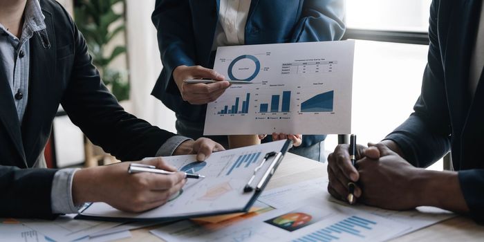 Business financial, accountant discussing with partner are meeting to audit finance planning sales to meet targets set in next year. stock market concept....