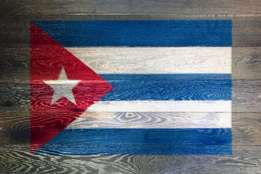 A Cuba flag on rustic old wood surface background