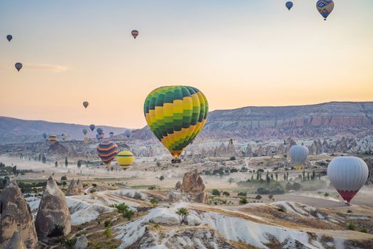 Colorful hot air balloon flying over Cappadocia, Turkey.