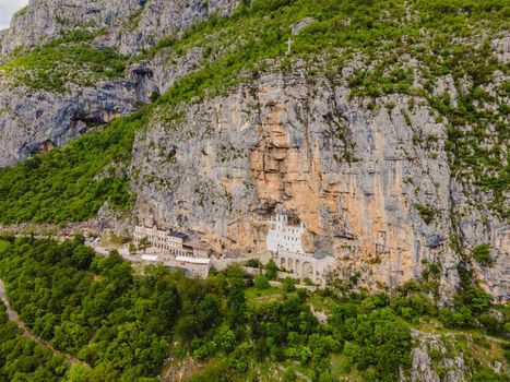 Monastery of Ostrog, Serbian Orthodox Church situated against a vertical background, high up in the large rock of Ostroska Greda, Montenegro. Dedicated to Saint Basil of Ostrog.