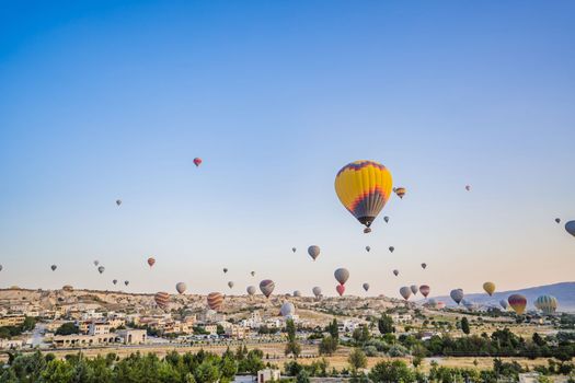 Colorful hot air balloon flying over Cappadocia, Turkey.