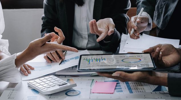 Asian business adviser meeting to analyze and discuss the situation on the financial report in the meeting room.Investment Consultant, Financial advisor and accounting concept..