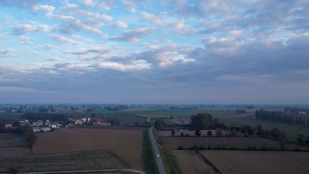 Stagno Lombardo, Italy - November 2022 drone view of rural area near river Po at dusk