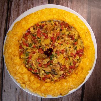 Recipe Omelette with peppers, onions, tomatoes, courgettes and coriander. High quality photo