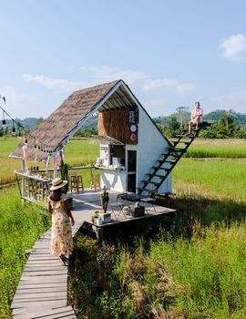 Nan Thailand December 2021, people visiting a coffee shop in the rice fields with white stairs a popular cafe at a homestay in Nan Thailand, Nathatha cafe