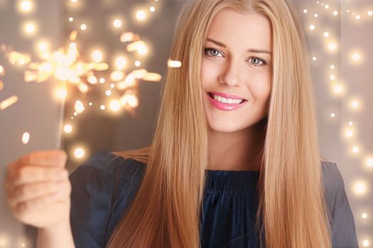 Holiday magic, Christmas and New Year celebration, happy woman with sparklers, portrait