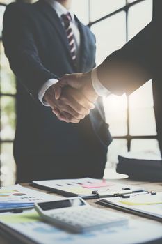 Business partnership meeting concept. Image businessmans handshake. Successful businessmen handshaking after good deal. Group support concept