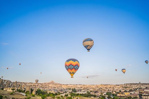 Colorful hot air balloon flying over Cappadocia, Turkey.