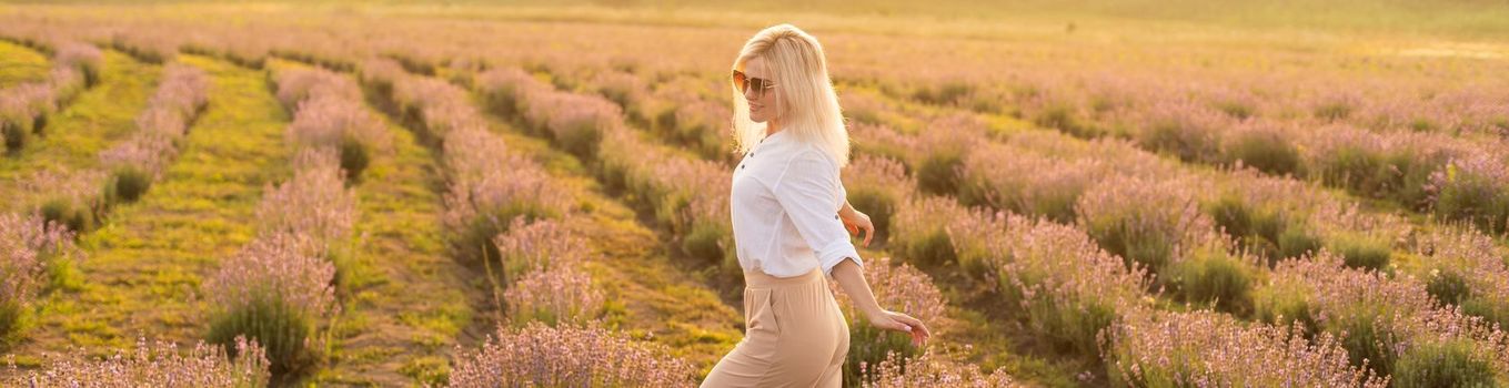 A Woman Walking in Lavender Field.