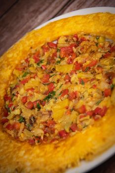 Recipe Omelette with peppers, onions, tomatoes, courgettes and coriander. High quality photo