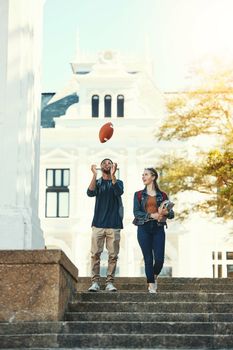 Campus, diversity and students walking outdoor with education or gen z communication on books, learning and fitness in summer. Young couple, friends or college people together talking of scholarship.