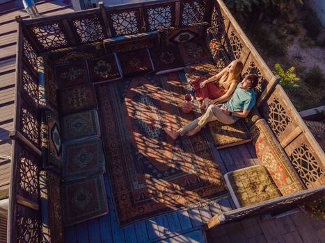 Beautiful morning in Cappadocia - a young couple on the Turkish terrace.