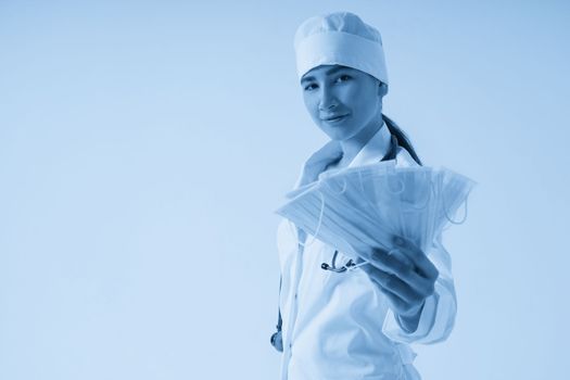 Doctor or nurse recommend to use protective face mask to protect from virus infection, studio shoot with white background