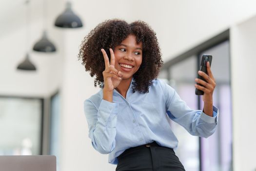 Business black woman having phone conversation with client in office. Woman reading news, report or email. Online problem, finance mistake, troubleshooting.