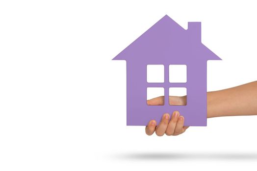 House in hand, isolation. Violet model of a house in the hands of a child isolated on a white background. Homeless housing, family home, home insurance, international family day.