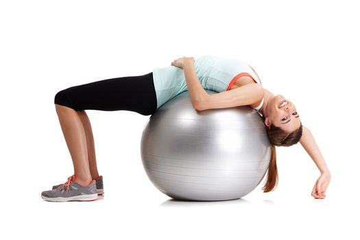 If it doesnt challenge you, it doesnt change you. a fit young woman exercising with her exercise ball isolated on white