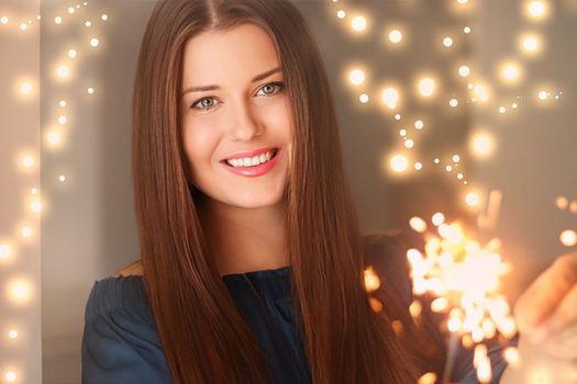 Holiday magic, Christmas and New Year celebration, happy woman with sparklers, portrait